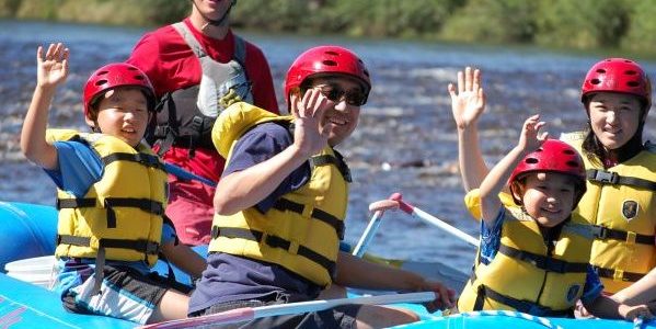 Family of 4 on a river raft