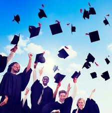 graduation students throwing their caps in the air