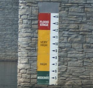 tide level marker on rock wall