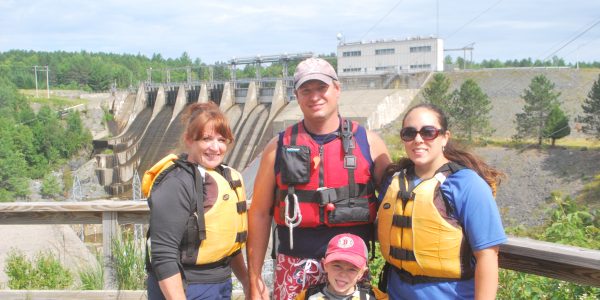 Group of rafters wearing sunscreen and ready to get on the river.