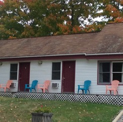 Exterior of the lodge with blue and pink deck chairs