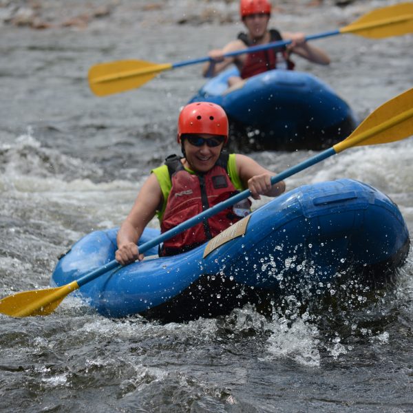 Two rafters enjoying the Deerfield river in inflatable kayaks - "funyaks."