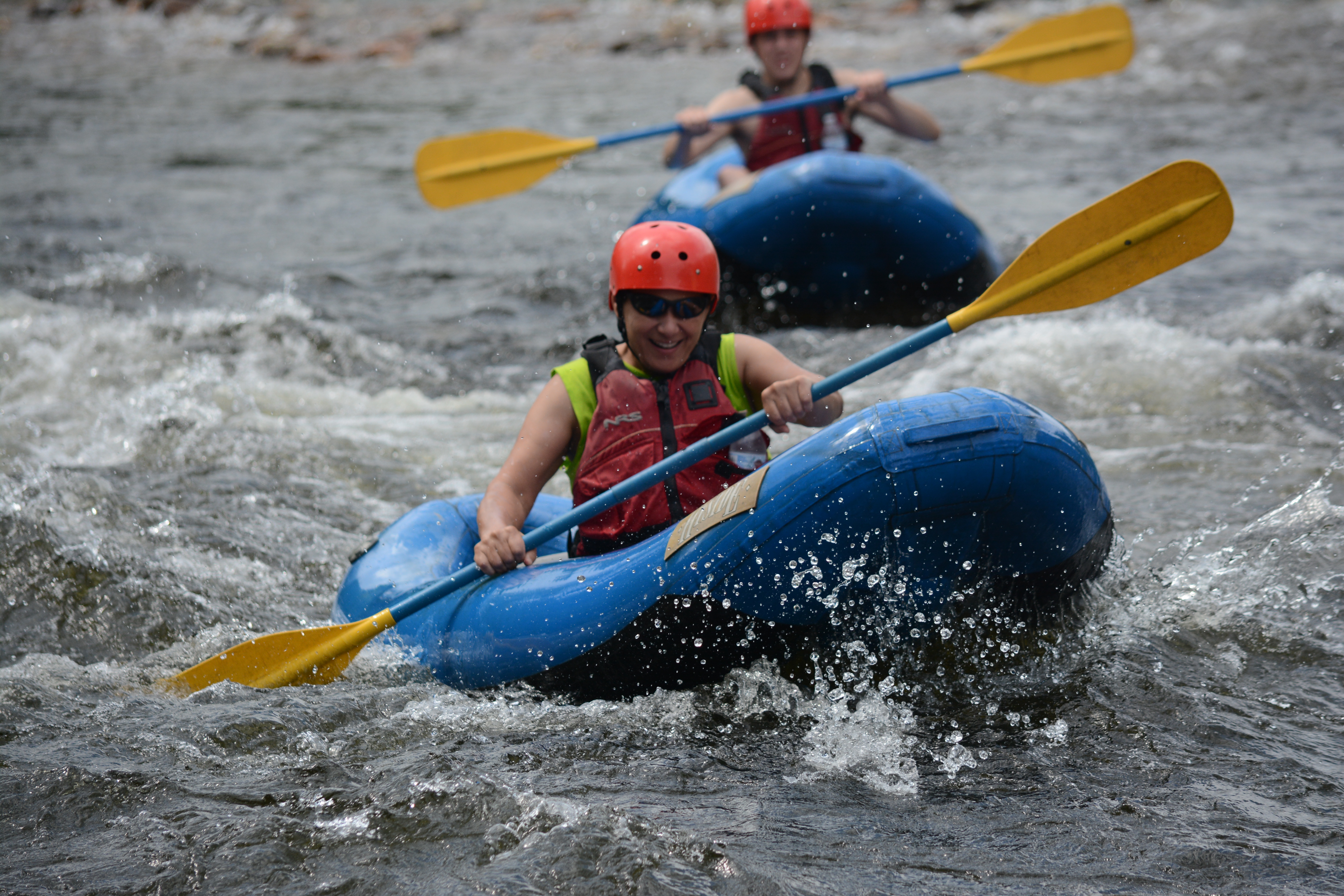Two rafters enjoying the Deerfield river in inflatable kayaks - "funyaks."