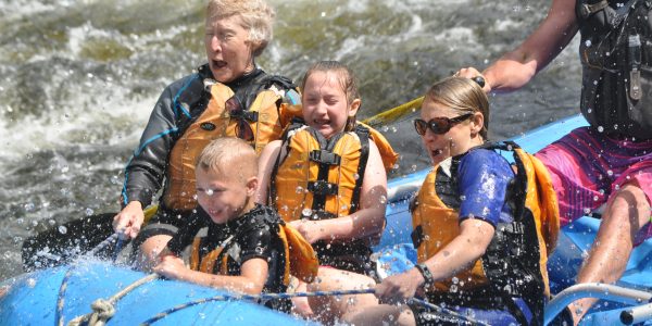 Family of 4 with guide in a raft on the Kennebec River