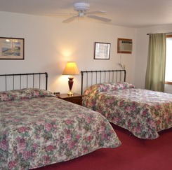 Bedroom in suite with two queen beds