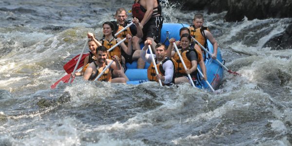 Group of eight rafts down the Kennebec River