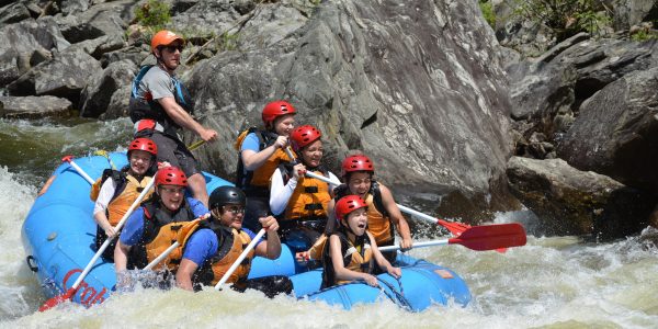 Raft with people and guide whitewater rafting